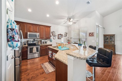 Welcome to 13523 Meadow Golf Ave, a beautifully maintained on Meadow Oaks Golf and Country Club in Florida - for sale on GolfHomes.com, golf home, golf lot