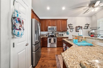 Welcome to 13523 Meadow Golf Ave, a beautifully maintained on Meadow Oaks Golf and Country Club in Florida - for sale on GolfHomes.com, golf home, golf lot