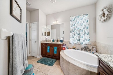 Welcome to 13523 Meadow Golf Ave, a beautifully maintained on Meadow Oaks Golf and Country Club in Florida - for sale on GolfHomes.com, golf home, golf lot