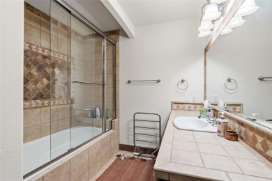 2140 Hunters Knob Road blends timeless masonry, elegant finishes on Raven Golf Club At Three Peaks in Colorado - for sale on GolfHomes.com, golf home, golf lot