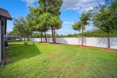 Welcome to 13523 Meadow Golf Ave, a beautifully maintained on Meadow Oaks Golf and Country Club in Florida - for sale on GolfHomes.com, golf home, golf lot