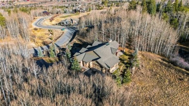2140 Hunters Knob Road blends timeless masonry, elegant finishes on Raven Golf Club At Three Peaks in Colorado - for sale on GolfHomes.com, golf home, golf lot