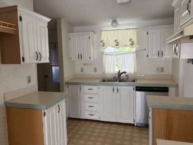 This home is in a 55 plus community with a monthly lot rent of on Crystal Lake Club in Florida - for sale on GolfHomes.com, golf home, golf lot