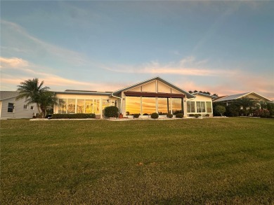 This stunning home offers unparalleled views of a tranquil lake on Freedom Fairways in Florida - for sale on GolfHomes.com, golf home, golf lot