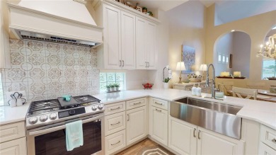 PRICE REDUCED!! LAKEFRONT LUXURY in Prestigious Bayou Club on Bayou Golf Club in Florida - for sale on GolfHomes.com, golf home, golf lot