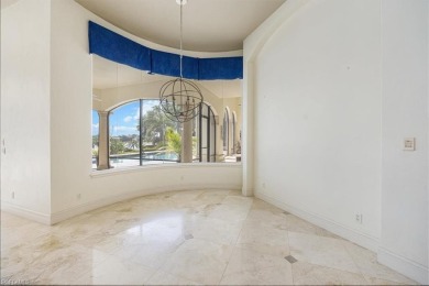 Sitting on a prime golf lake front lot, this custom estate on Quail West Golf and Country Club in Florida - for sale on GolfHomes.com, golf home, golf lot