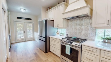 PRICE REDUCED!! LAKEFRONT LUXURY in Prestigious Bayou Club on Bayou Golf Club in Florida - for sale on GolfHomes.com, golf home, golf lot