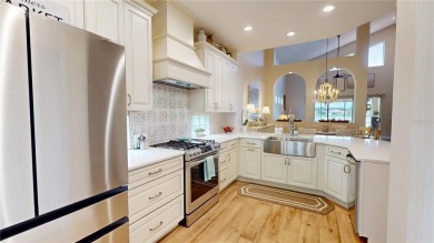 PRICE REDUCED!! LAKEFRONT LUXURY in Prestigious Bayou Club on Bayou Golf Club in Florida - for sale on GolfHomes.com, golf home, golf lot