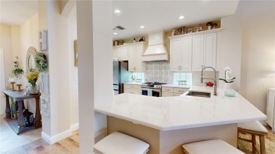 PRICE REDUCED!! LAKEFRONT LUXURY in Prestigious Bayou Club on Bayou Golf Club in Florida - for sale on GolfHomes.com, golf home, golf lot