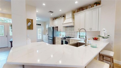 PRICE REDUCED!! LAKEFRONT LUXURY in Prestigious Bayou Club on Bayou Golf Club in Florida - for sale on GolfHomes.com, golf home, golf lot