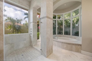 Sitting on a prime golf lake front lot, this custom estate on Quail West Golf and Country Club in Florida - for sale on GolfHomes.com, golf home, golf lot