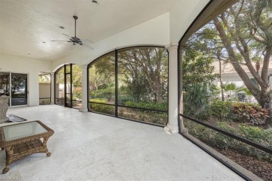 Sitting on a prime golf lake front lot, this custom estate on Quail West Golf and Country Club in Florida - for sale on GolfHomes.com, golf home, golf lot