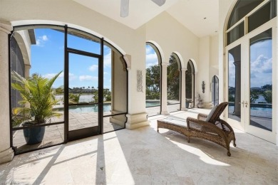 Sitting on a prime golf lake front lot, this custom estate on Quail West Golf and Country Club in Florida - for sale on GolfHomes.com, golf home, golf lot