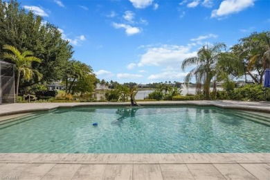 Sitting on a prime golf lake front lot, this custom estate on Quail West Golf and Country Club in Florida - for sale on GolfHomes.com, golf home, golf lot