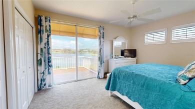 PRICE REDUCED!! LAKEFRONT LUXURY in Prestigious Bayou Club on Bayou Golf Club in Florida - for sale on GolfHomes.com, golf home, golf lot