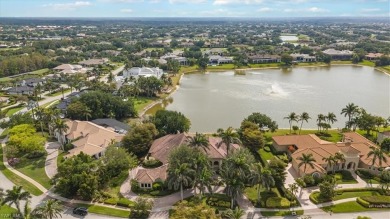 Sitting on a prime golf lake front lot, this custom estate on Quail West Golf and Country Club in Florida - for sale on GolfHomes.com, golf home, golf lot