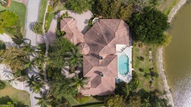 Sitting on a prime golf lake front lot, this custom estate on Quail West Golf and Country Club in Florida - for sale on GolfHomes.com, golf home, golf lot