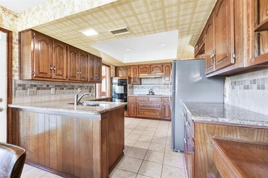 Enjoy beautiful curb appeal, directly across from 58 acre on Sherrill Park Golf Course in Texas - for sale on GolfHomes.com, golf home, golf lot