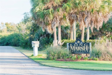 This stunning WATERFRONT lot is located in the golf community of on Rotonda Golf and Country Club - Long Marsh  in Florida - for sale on GolfHomes.com, golf home, golf lot