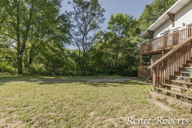 Discover country living in this 3-bedroom, 1.5-bath contemporary on Thoroughbred Golf Club in Michigan - for sale on GolfHomes.com, golf home, golf lot