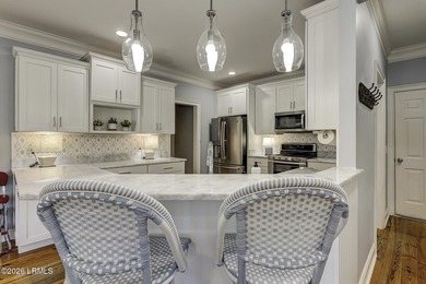 Nestled on a quiet street beneath stunning live oaks, this on The Golf Club at Pleasant Point Plantation in South Carolina - for sale on GolfHomes.com, golf home, golf lot