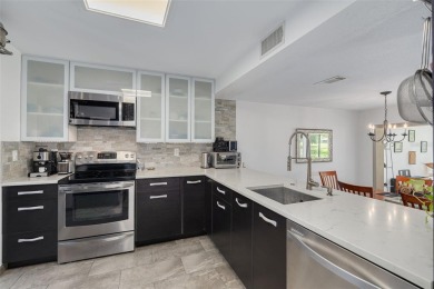 EXQUISITELY REMODELED two-story townhome in the heart of the on East Lake Woodlands Country Club in Florida - for sale on GolfHomes.com, golf home, golf lot