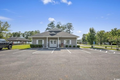 A charming three-bedroom, two-bathroom ranch-style home with a on Heron Point Golf Club in South Carolina - for sale on GolfHomes.com, golf home, golf lot