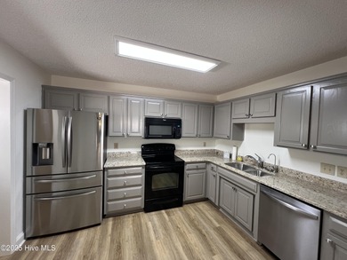 The upgrades look fantastic! NEW FLOORING on the main level; on River Bend Golf and Country Club in North Carolina - for sale on GolfHomes.com, golf home, golf lot