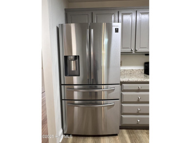 The upgrades look fantastic! NEW FLOORING on the main level; on River Bend Golf and Country Club in North Carolina - for sale on GolfHomes.com, golf home, golf lot