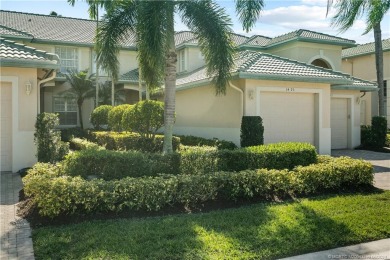 1st floor villa offers golf course views from its screened lanai on Santa Lucia River Club in Florida - for sale on GolfHomes.com, golf home, golf lot