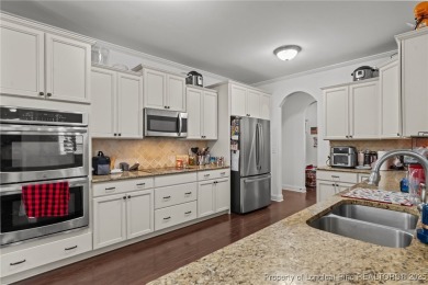 Welcome home! Step inside this spacious 6-bedroom, 4-bathroom on Anderson Creek Golf Club in North Carolina - for sale on GolfHomes.com, golf home, golf lot