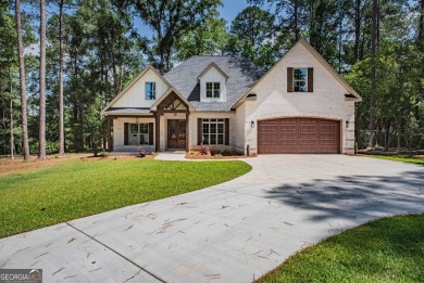 Nestled on 2.22 acres, this exquisite new construction two-story on Perry Country Club in Georgia - for sale on GolfHomes.com, golf home, golf lot