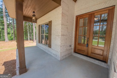 Nestled on 2.22 acres, this exquisite new construction two-story on Perry Country Club in Georgia - for sale on GolfHomes.com, golf home, golf lot