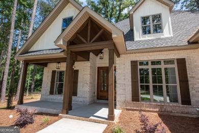 Nestled on 2.22 acres, this exquisite new construction two-story on Perry Country Club in Georgia - for sale on GolfHomes.com, golf home, golf lot