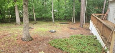 OWNER FINANCING AVAILABLE !!!  This two bedroom, one bath on River Golf and County Club at Lake Royale in North Carolina - for sale on GolfHomes.com, golf home, golf lot