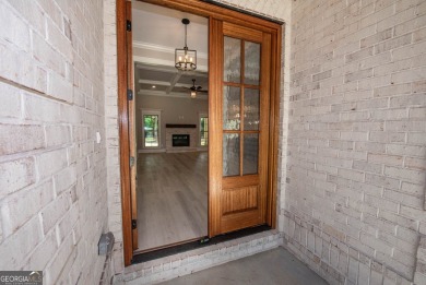 Nestled on 2.22 acres, this exquisite new construction two-story on Perry Country Club in Georgia - for sale on GolfHomes.com, golf home, golf lot