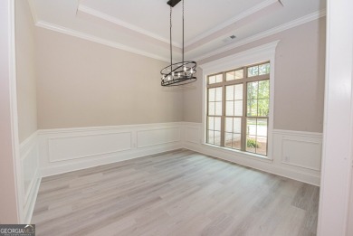 Nestled on 2.22 acres, this exquisite new construction two-story on Perry Country Club in Georgia - for sale on GolfHomes.com, golf home, golf lot