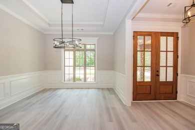 Nestled on 2.22 acres, this exquisite new construction two-story on Perry Country Club in Georgia - for sale on GolfHomes.com, golf home, golf lot