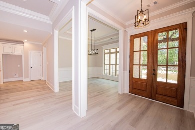 Nestled on 2.22 acres, this exquisite new construction two-story on Perry Country Club in Georgia - for sale on GolfHomes.com, golf home, golf lot