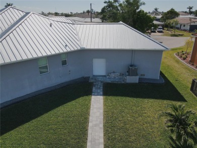 **Exceptional Waterfront Home in PGI with Spectacular Canal on Saint Andrews South Golf Club in Florida - for sale on GolfHomes.com, golf home, golf lot