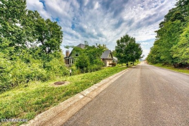 Take advantage of this amazing view and gorgeous sunsets in TN on Tennessee National Golf Club in Tennessee - for sale on GolfHomes.com, golf home, golf lot