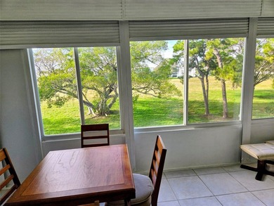 ITS ALL ABOUT THE LANAI & THE VIEWS IN THIS Bright and inviting on Hillsboro Pines Golf in Florida - for sale on GolfHomes.com, golf home, golf lot