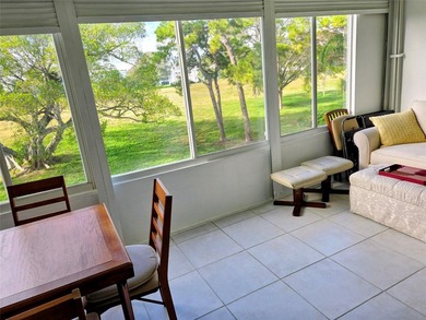 ITS ALL ABOUT THE LANAI & THE VIEWS IN THIS Bright and inviting on Hillsboro Pines Golf in Florida - for sale on GolfHomes.com, golf home, golf lot
