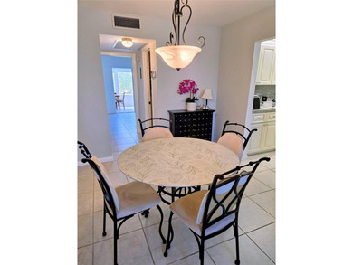 ITS ALL ABOUT THE LANAI & THE VIEWS IN THIS Bright and inviting on Hillsboro Pines Golf in Florida - for sale on GolfHomes.com, golf home, golf lot