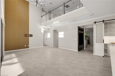 Discover refined luxury within the contemporary ambiance of this on Old Corkscrew Golf Club in Florida - for sale on GolfHomes.com, golf home, golf lot