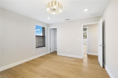 Discover refined luxury within the contemporary ambiance of this on Old Corkscrew Golf Club in Florida - for sale on GolfHomes.com, golf home, golf lot