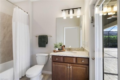 Discover refined luxury within the contemporary ambiance of this on Old Corkscrew Golf Club in Florida - for sale on GolfHomes.com, golf home, golf lot
