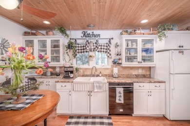Charming Country Cottage with Modern Comforts and Serene Privacy on Canadian Lakes Country Club-The Royal Course in Michigan - for sale on GolfHomes.com, golf home, golf lot