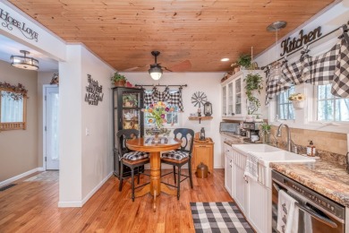 Charming Country Cottage with Modern Comforts and Serene Privacy on Canadian Lakes Country Club-The Royal Course in Michigan - for sale on GolfHomes.com, golf home, golf lot