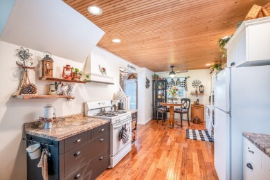 Charming Country Cottage with Modern Comforts and Serene Privacy on Canadian Lakes Country Club-The Royal Course in Michigan - for sale on GolfHomes.com, golf home, golf lot